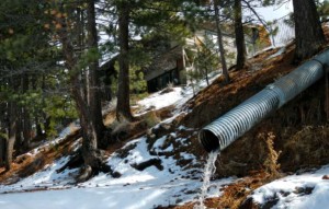 Water, this month, flows from the pipe below the Alta Mira building in South Lake Tahoe into Lake Tahoe. Photo/LTN