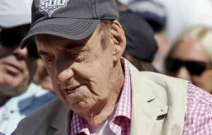 Jim Nabors, who will sign "(Back Home Again in) Indiana" for his final time at tomorrow's Indianapolis 500 IndyCar auto race, tries on a ring the was presented to him during the drivers meeting at the Indianapolis Motor Speedway in Indianapolis, Saturday, May 24, 2014. The 98th running of the Indianapolis 500 is Sunday. Nabors has sung the song for 37 years during pre-race festivities. (AP Photo/Darron Cummings)