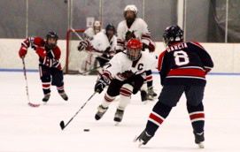 Tucker Cannon, center, maneuvers around defenders. Photo/Provided