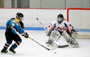 Katie Sonntag, who is about to score, wants to be on the U.S. hockey team one day. Photo/Provided