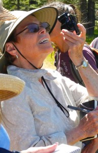 Suzanne Stone uses a discovery scope to better see small flowers.
