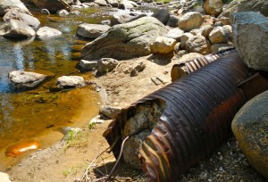 This cement filled culvert will be removed as part of the restoration efforts at the old Tahoe Pines Campground. Photo/LTN