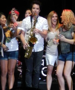 Several women are invited on stage to sing and take selfies with Pat Monahan.