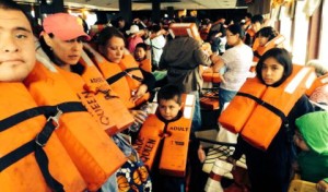Passengers of the Tahoe Queen were given life jackets to wear on rescue boats; including a child having to wear an adult jacket. Photo/Pedro Martinez