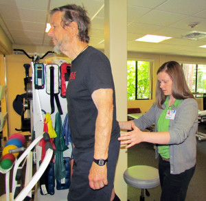 Physical therapist Kelly Skelly, right, assesses Rick Robinson's balance in an "Exercise for Energy" class.