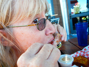 Sue enjoys one of the ribs.