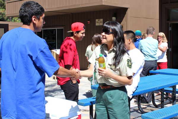 Adrian Ortega talks with Joy Barney from the U.S. Forest Service. Photo/Holly Greenough