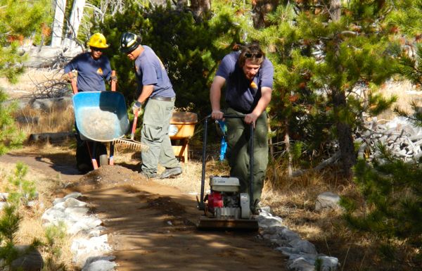 Erick Estrada, from left, Eddie Cuttman and Zackery Schell finish trail improvement at Washoe Meadows State Park. Photo/Kathryn Reed