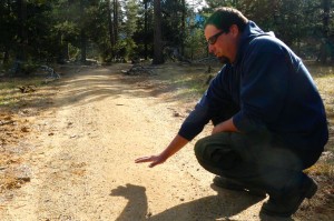 Nathan Shasha with State Parks shows the contour of the new trail.