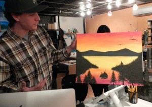 Matt Kauffmann drawing the straight line for the horizon on the Emerald Bay painting is the hardest for people.