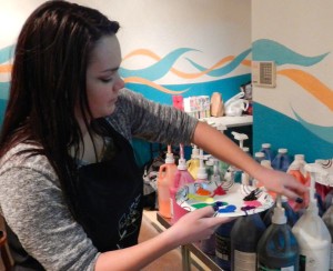 Shalynn Swails gets paint ready for people.
