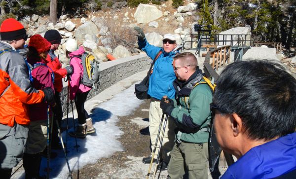 TRTA leader Jim Mrazek, in blue, pauses on the dam at Echo Lake to talk about the area. Photos/Kathryn Reed