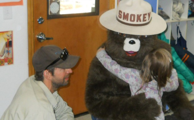 Smokey Bear warning kids about illegal fires