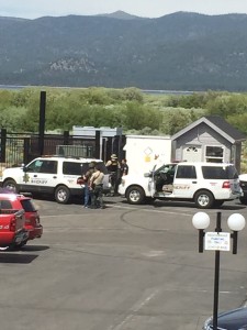 Law enforcement surround the suspect Saturday afternoon at the Tahoe Keys Marina. Photo/Kathryn Reed