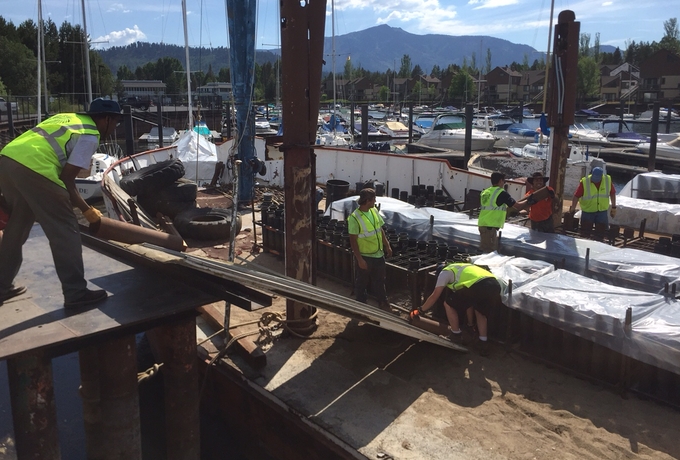 Employees of Grucci load the barges June 30 at Tahoe Keys Marina with canisters that will be filled with pyrotechnics. Photos/Kathryn Reed