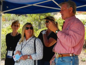 Idaho Gov. Butch Otter, right, talks about what his state is doing to fight fires.