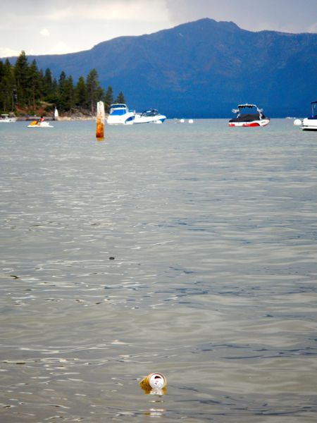 A beer can floats in Lake Tahoe.