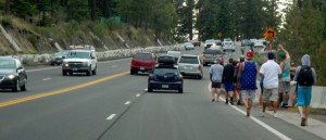 Vehicles and pedestrians fill the lanes of Highway 50.