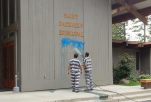 Washoe County inmates clean the graffiti off the church. Photo/Provided
