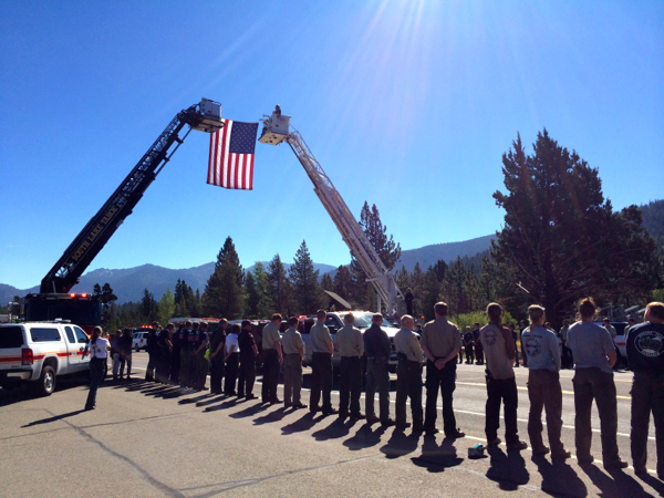 People line Highway 50 in Meyers to honor firefighter Michael Hallenbeck. Photos/Kim Wyatt