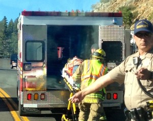 Paramedics tend to a motorcyclist who was crashed Aug. 3 on Spooner Summit. Photo/Janill Gilbert