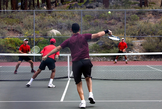 8.0 Mens Division Champions and brothers, Dennis and Jim Thorne, defend an overhead from consolation round winners, Steve Reid and Randall Osterhues.jpg