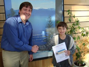 Sierra House Elementary School fourth-grader Dominic Herron with LTBMU Supervisor Jeff Marsolais. Photo/USFS