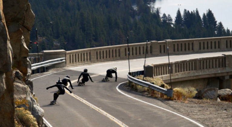 Skateboarders plunge down twisty Donner Pass