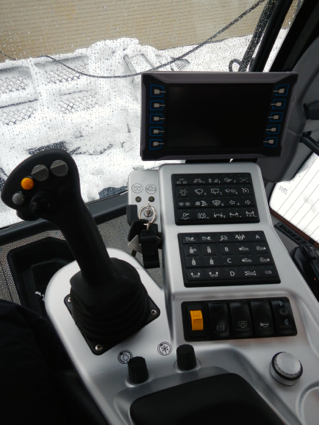 Drivers sit in the middle of the cab with a slew of controls at their fingertips.