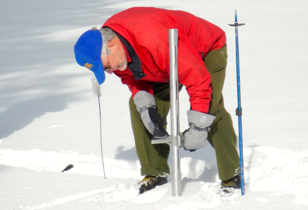 Frank Gehrke takes a reading on the water content on Dec. 30 near Sierra-at-Tahoe. Photo/Kathryn Reed