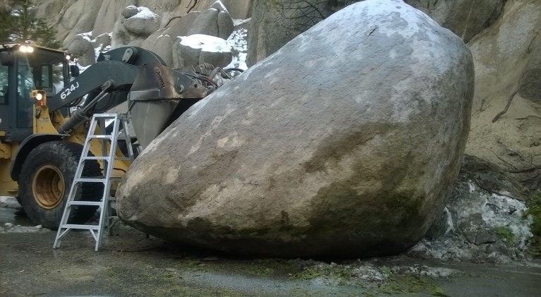 Massive boulder blocks Hwy. 50
