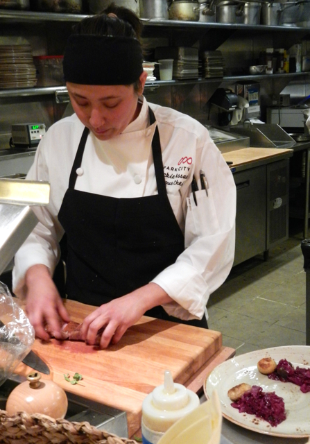 Sous chef Jackie Assaad at The Farm plates an entree. Photo/Kathryn Reed