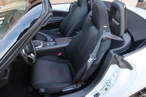 Specifications Price $24,915 to about $33,000 plus $820 for the boat from Hiroshima, Japan Engine 2.0L inline four cylinder DOHC, 16 valves 155 hp @ 6,000 rpm     		 148 lb.-ft. of torque @ 4,600 rpm	 Transmission Six-speed manual Six-speed torque converter automatic Configuration Longitudinal front engine/rear wheel drive Dimensions Wheelbase 90.9 inches Length 154.1 inches Width 68.3 inches Height (17 inch wheels) 48.8 inches Ground Clearance (17 inch wheels) 5.32 inches Track (f/r) 58.9/59.2 inches Fuel Capacity 11.9 gallons Truck volume 4.6 cubic feet Turning circle (wall to wall) 32.9 feet Steering lock to lock 2.7 turns Wheels (std/opt) 16X6.5/17X7 inches  Tires (std//opt) 195/50X16//205/45X17 Weight 2,332 pounds Weight distribution (f/r) 53/47 percent Performance 0-60 mph 5.75 seconds 50-70 mph 3.42 seconds (3rd gear) 50-70 up hill (6%) 4.55 seconds Top Speed Estimate 140 plus mph (have ear plugs) Fuel economy EPA rated 27/34/30 mpg city/highway/combined. Estimate 30-32 mpg in suburban driving, 35 mpg in rural driving and 37-38 mpg at 70 mph on level ground. 