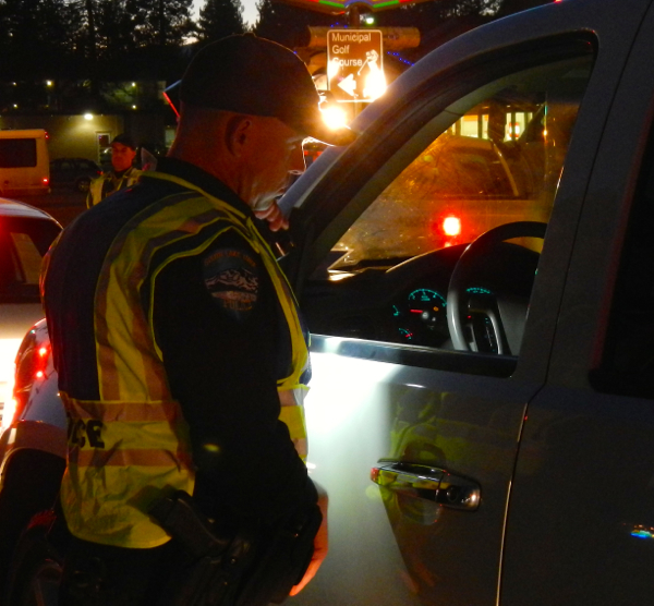 Officer Chris Mahoney asks to see the driver's license.