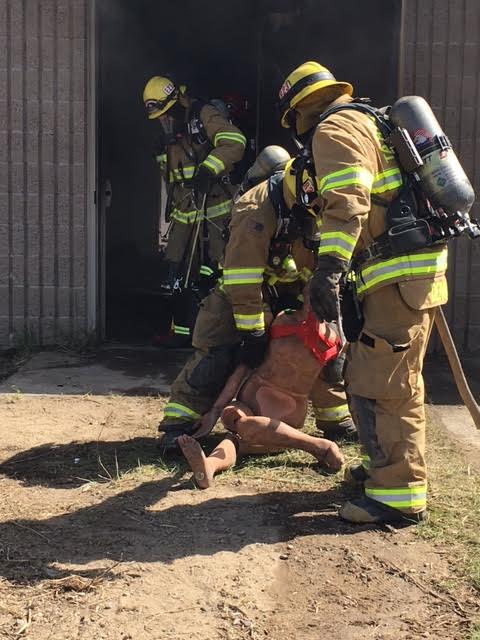 Tahoe Douglas firefighters practice rescuing a person from a burning building. Photo/Provided