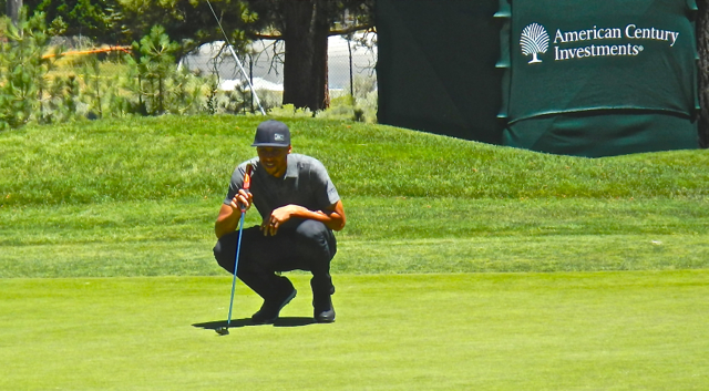 Steph Curry lines up his putt during the July 21 practice round. Photo/Kathryn Reed