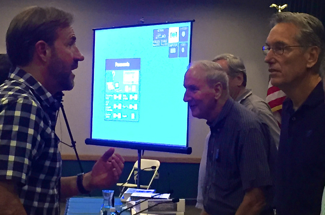 Immediately after the vote Aug. 11, Squaw CEO Andy Wirth, left, went to speak with Commissioner Wayne Nader, who voted no. Photo/LTN