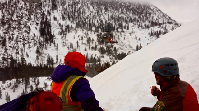 The helicopter arrives to transport a lost person from Maggies Peak in February. Photo/Provided