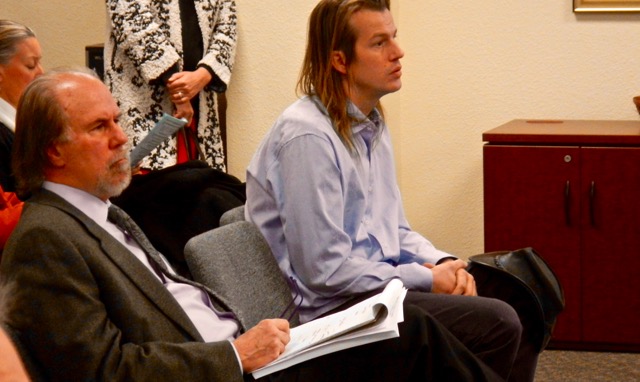 Cody Bass, right, with his attorney Henry Wykowski listen Dec. 13 to the South Lake Tahoe City Council deliberate. Photo/Kathryn Reed