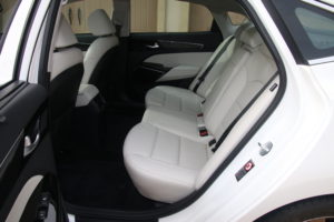 Specifications Price (with destination) $32,890 to about $45,290 Engine 3.3L DOHC, 24 valve V-6 290 hp A 6,400 rpm 253 ft.-lbs. of torque @ 5,200 rpm Transmission eight speed torque converter automatic with paddle shifters Configuration Transversely mounted front engine/front wheel drive Dimensions Wheelbase 112.4 inches Length 195.7 inches Width 73.6 inches Height 57.9 inches Track (f/r) 63.1/63.4 inches Weight (18”/19” wheels) 3,633/3,799 pounds Ground clearance 5.4 inches Fuel Capacity 18.5 gallons Cabin interior volume 107.8 cubic feet Trunk volume 16.0 cubic feet Turning circle 37.2 feet Steering lock to lock 2.71 turns Wheels (std/opt) 18X7.5/19X8.0 inch alloys Tires (std/opt) 245/45X18/245/40X19 inch radials Performance 0-60 mph 5.94 seconds 50-70 mph 3.15 seco9nds 50-70 mph uphill 4.71 seconds Top speed Way beyond sanity Fuel economy EPA rated at 20/28/23 mpg city/highway/combined. Expect 34 mpg in highway driving at legal speeds and 25-26 mpg overall in suburban/rural driving.