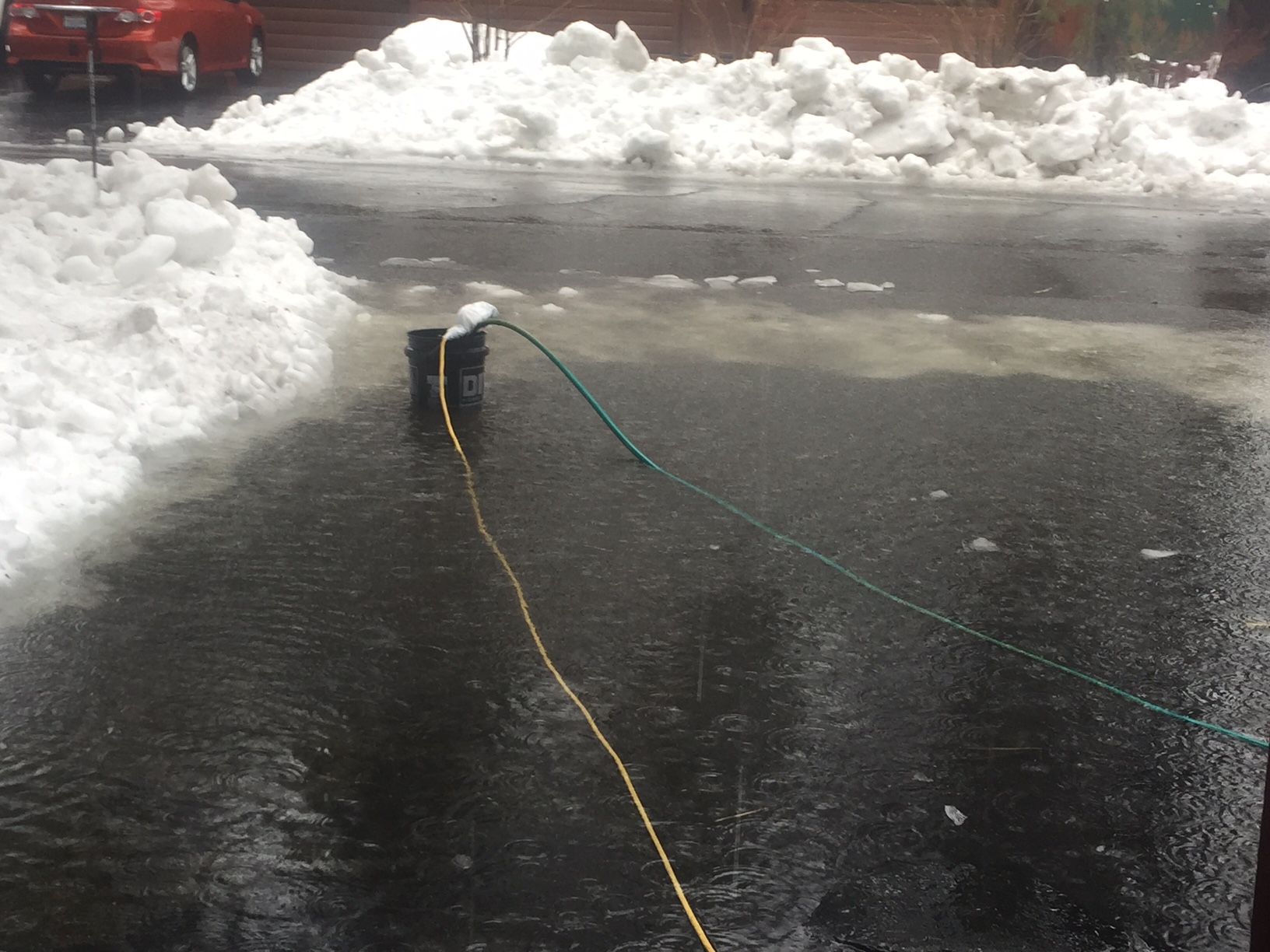 A sump pump works to remove water Jan. 8 from a flooded driveway in South Lake Tahoe. Photo/Susan Wood