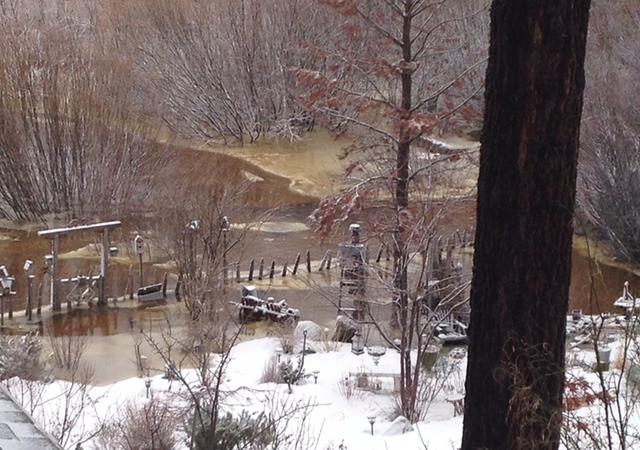 Manhole covers are covered in water and Trout Creek is 15 feet into some properties in South Lake Tahoe. Photo/Lisa Huard
