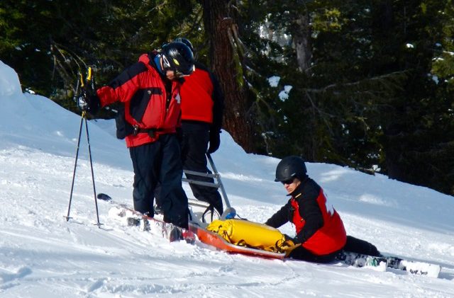 Ski patrollers have ambulances on their backs