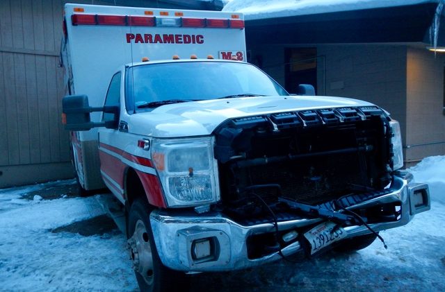 SLT ambulance rear-ends vehicle on highway