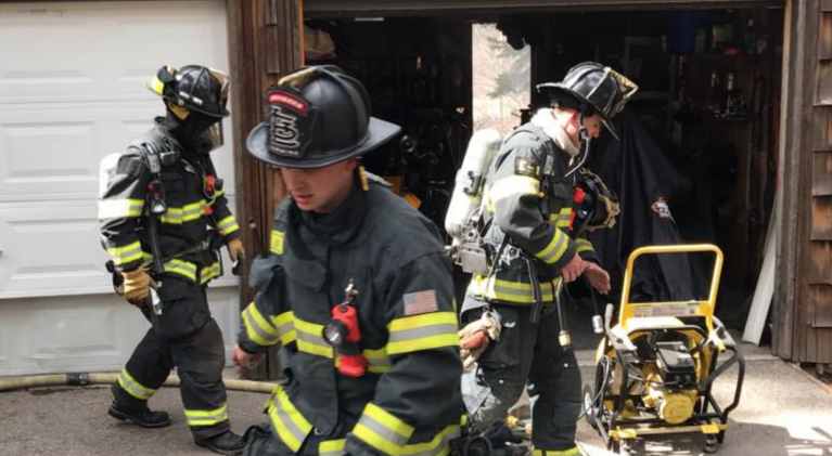 Hot ashes spark garage fire