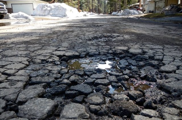 Brown signs mega-tax to fix Calif. roads, bridges